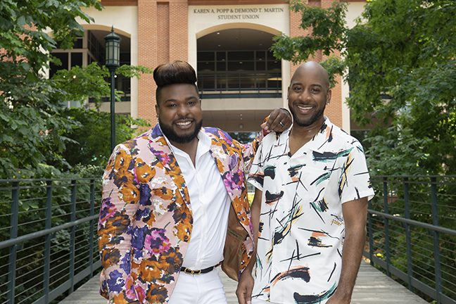 Lance and Antonio posing on campus