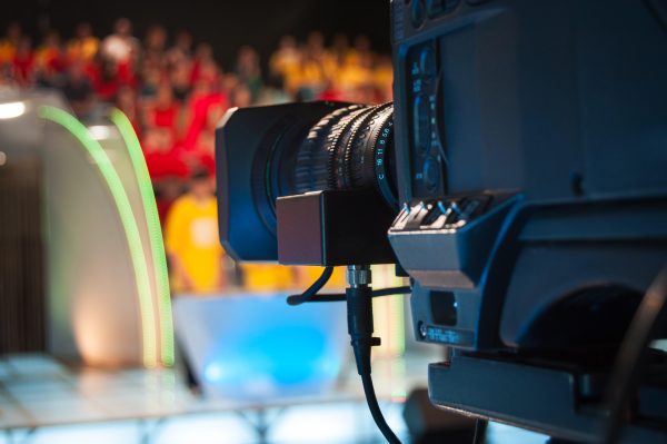 Close-up shot of a video camera for shooting or recording a show in a TV studio.