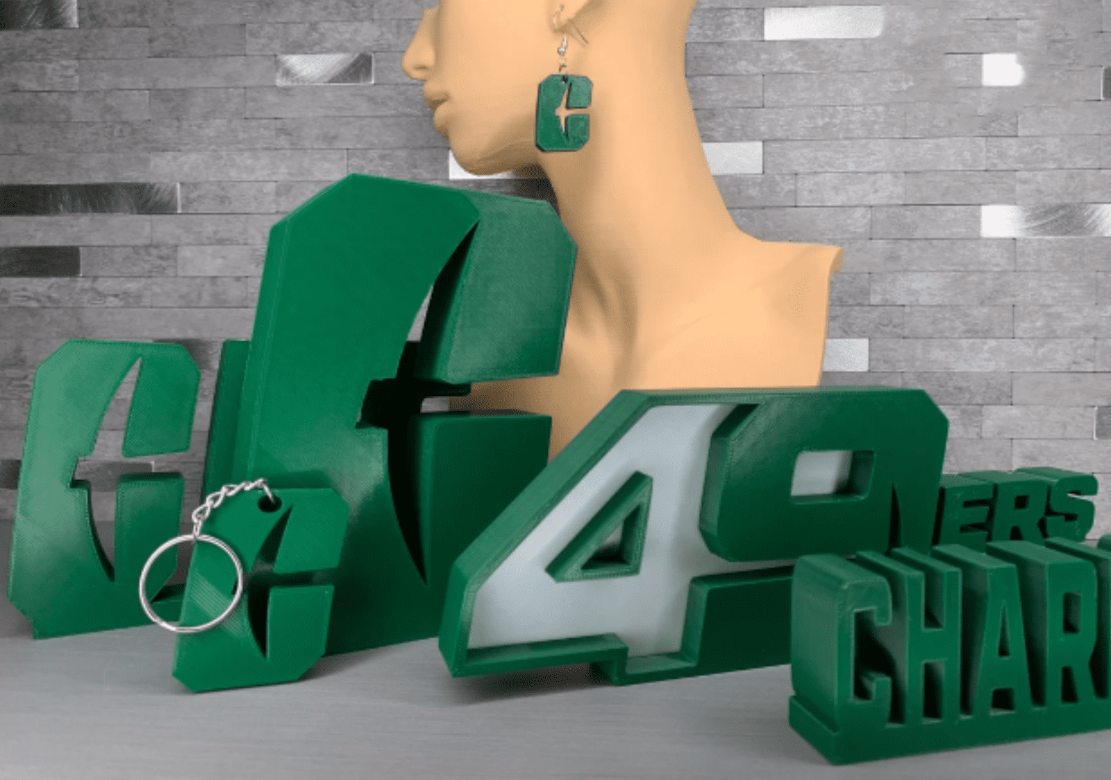 3D green letters and numbers, a mannequin head with a 