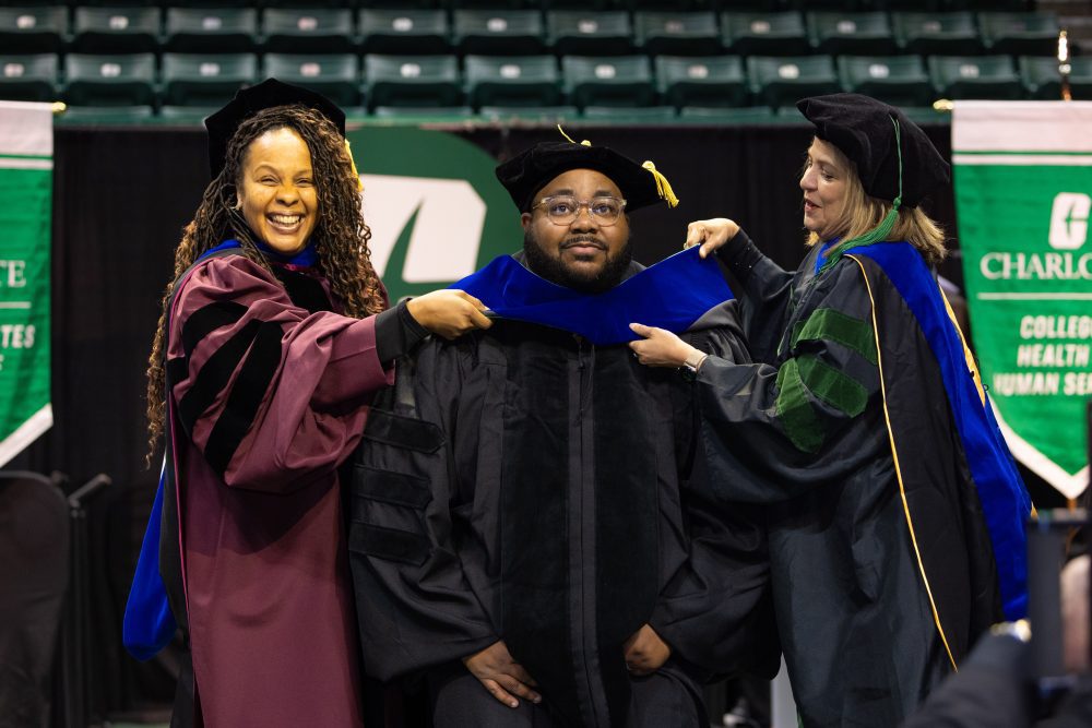 Doctoral student gets hooded