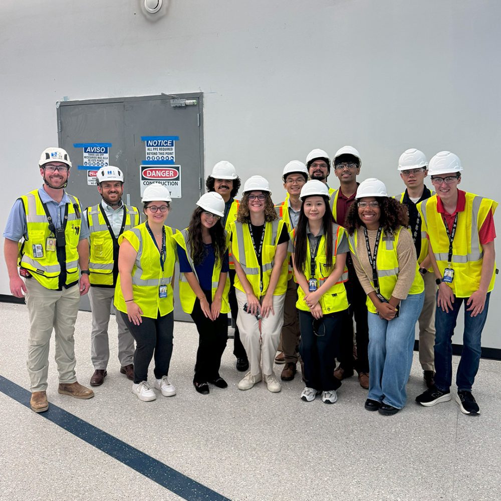 Myla Marve and interns posing in hard hats