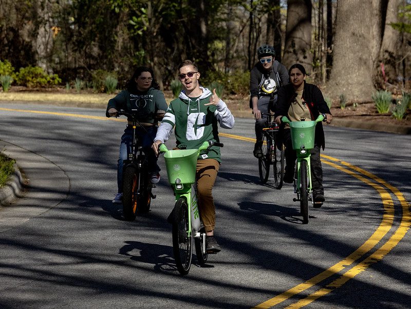 Students bike during Anything that Rolls Event