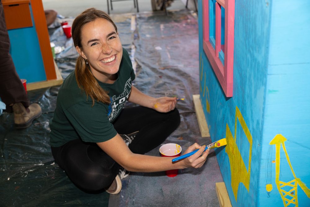 Levine Scholar paints outside of playhouse