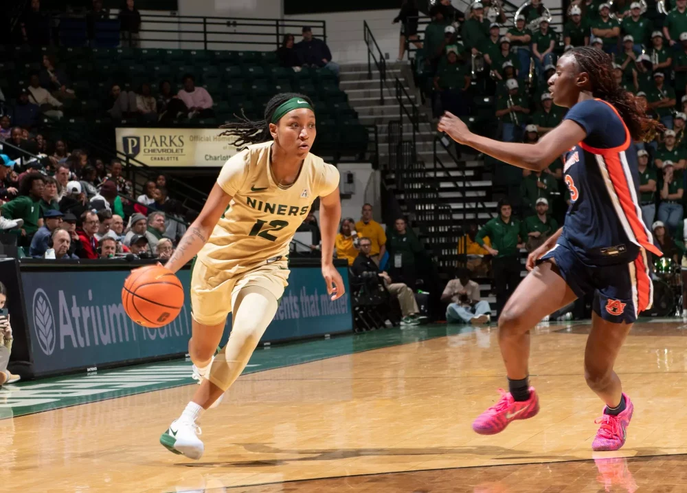 Women's basketball player driving to the basket against Auburn