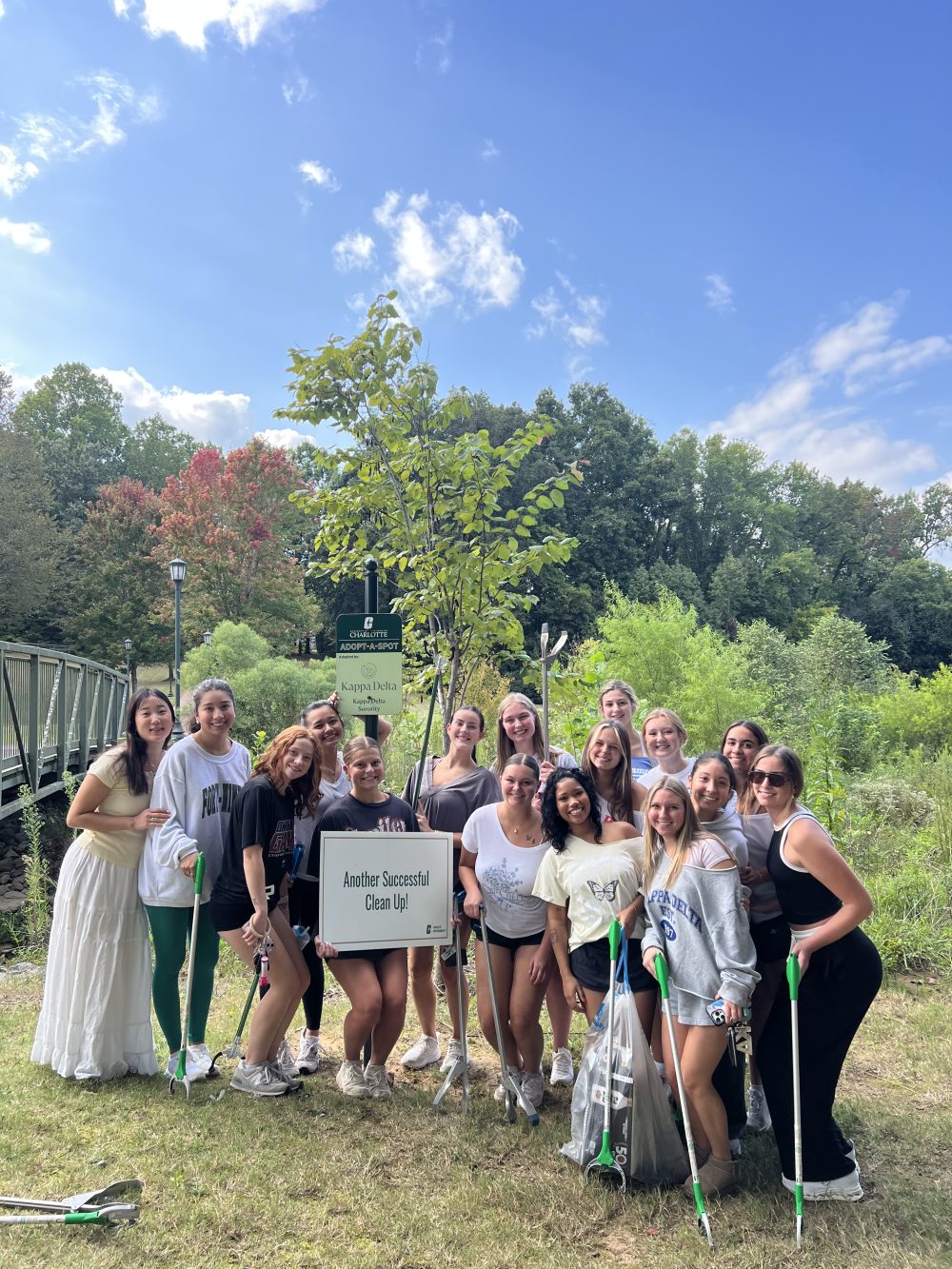 Kappa Delta sorority poses after cleaning up it's designated spot on campus.