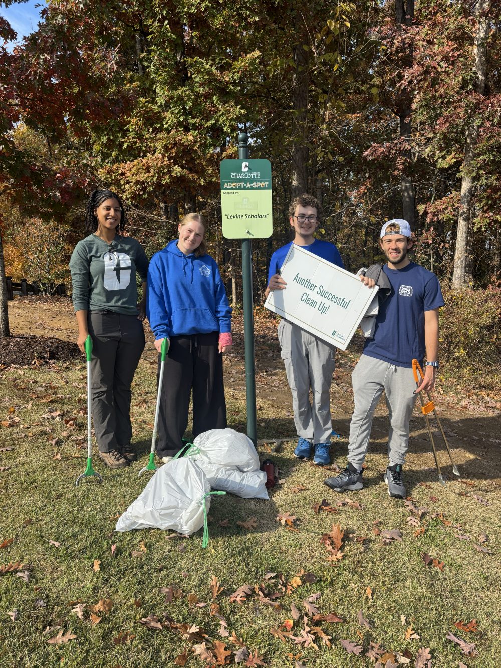 Levine Scholars pose after cleaning up it's designated spot on campus.