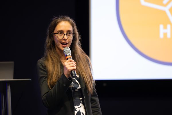 Caroline West presenting at Three Minute Thesis