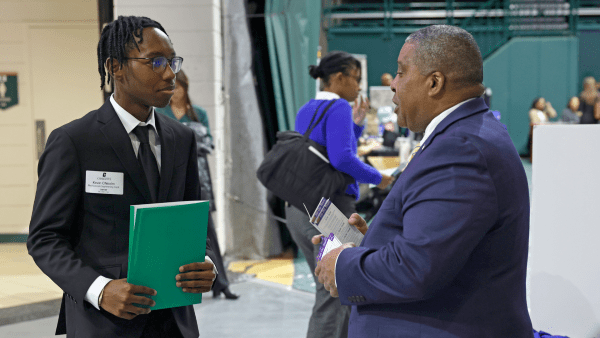 Charlotte student networking at career fair