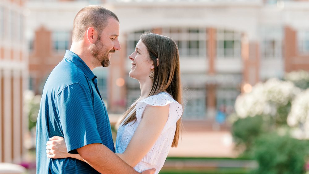 Niner couple embrace outside Cauble Quad