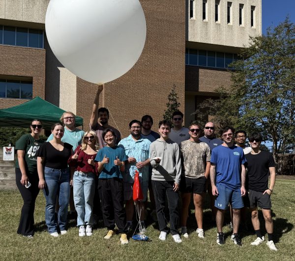 STORM club holding a weather balloon