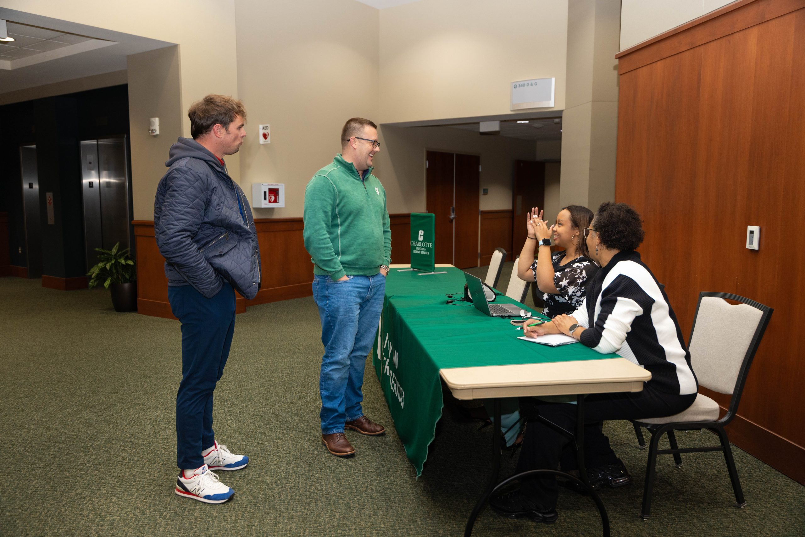 Elizabeth Beattie speaking with military-affiliated members of the campus community
