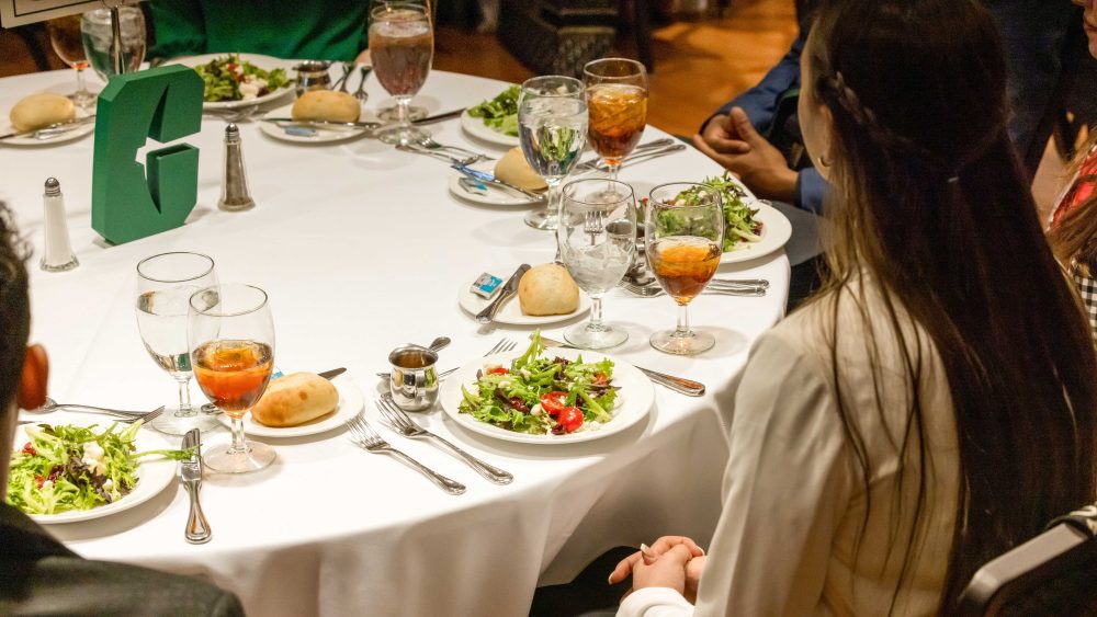 Student sits at the first Dinner with 9 Niners last year