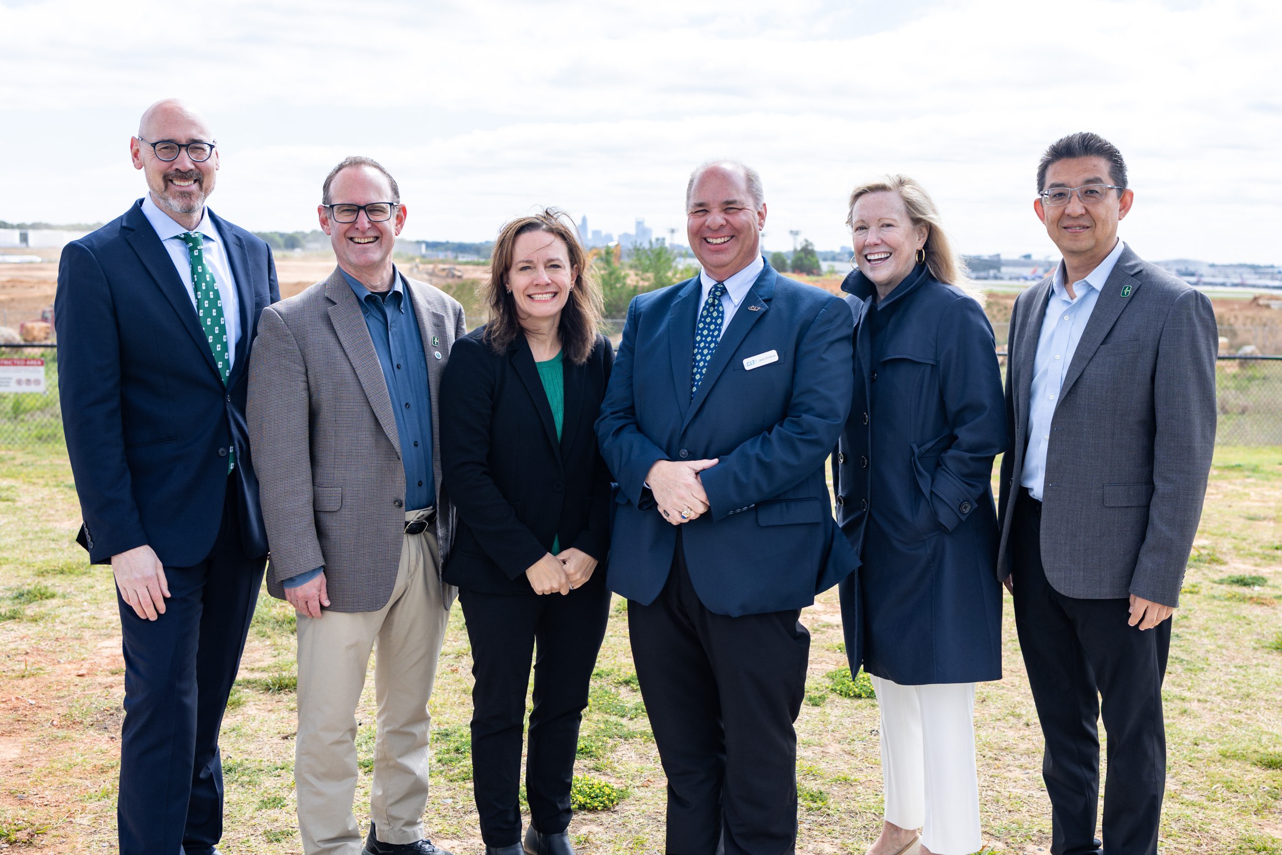 Tara Cavalline and Jack Christine (center) with (l to r) Vice Chancellor John Daniels, Dean Rob Keynton, Chancellor Sharon Gaber and Executive Director Lingguang Song.