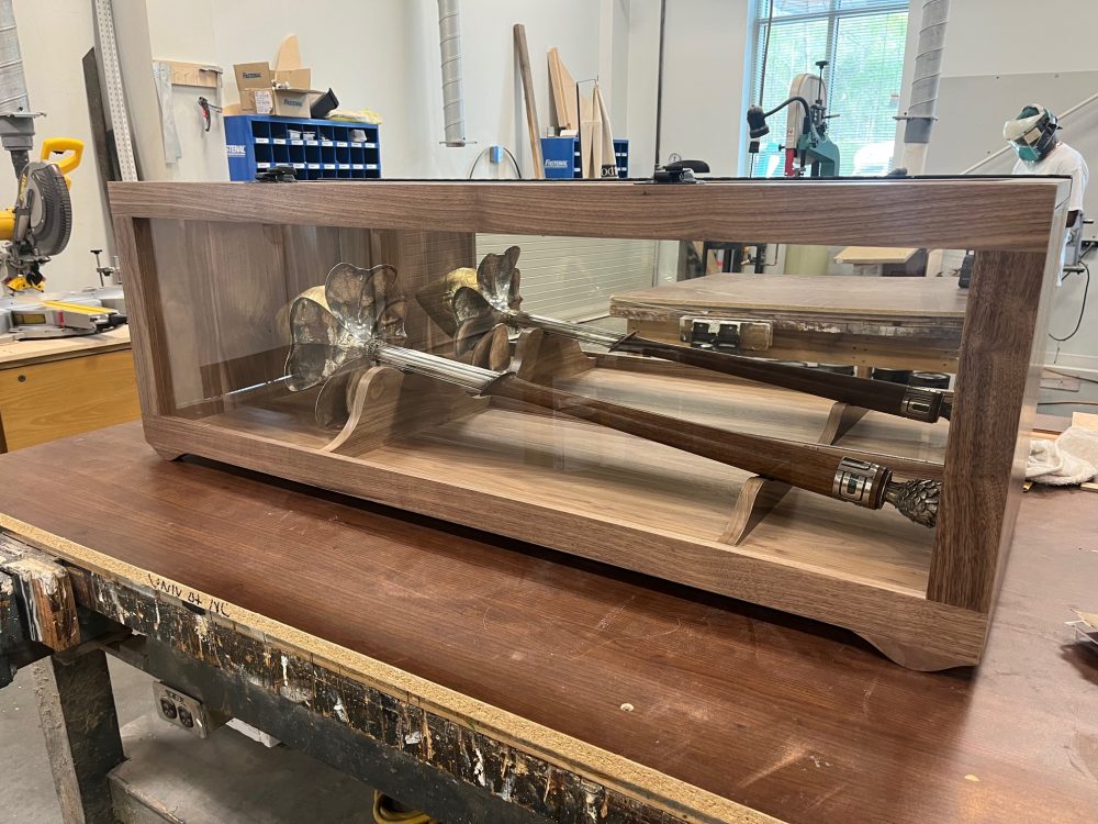 the university mace in it's new walnut case