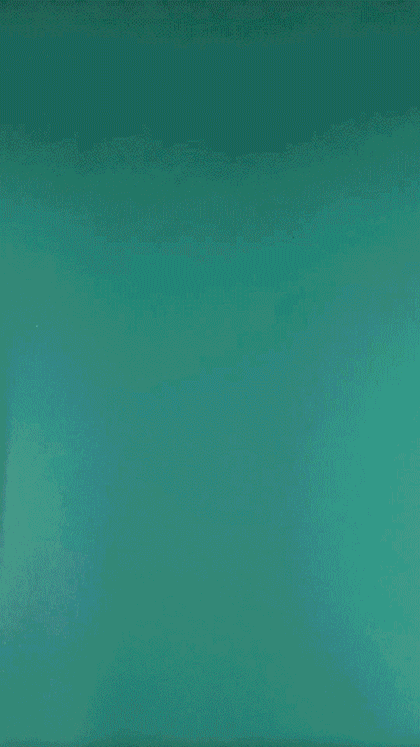 Animated gif of a green and white watch being unboxed.