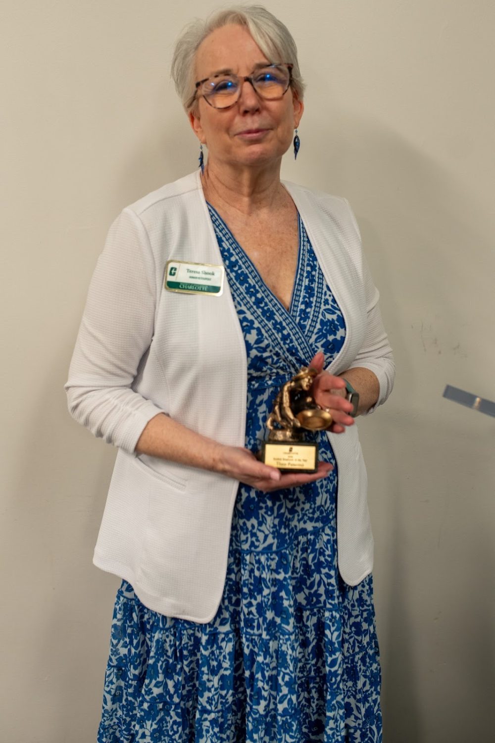 Teresa Shook holds the Student Employee of the Year Award