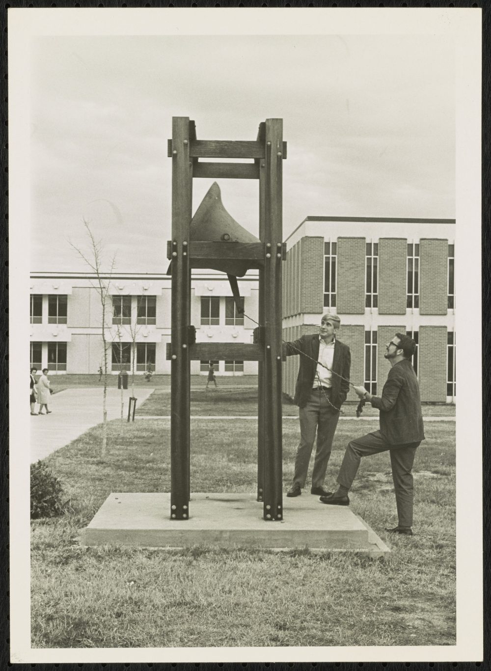 Student Body President John Gaithen rings the bell following news that UNC Charlotte had received accreditation from the Southern Association of Colleges and Schools, November 29, 1967.