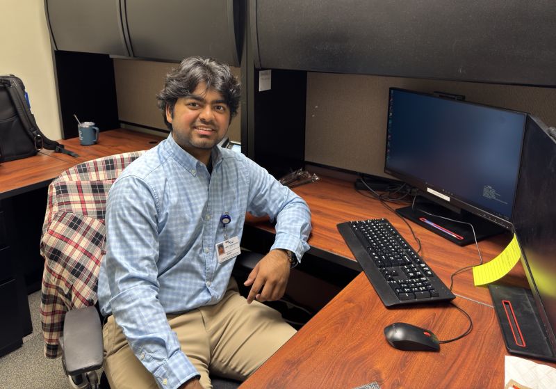 Arnav Gandhi sits at his desk at Cape Fear Valley Health