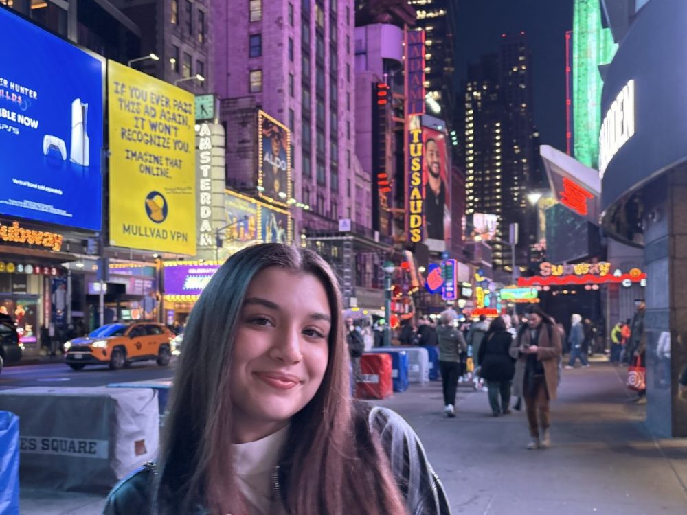 Aliyah March stands in Times Square in New York City