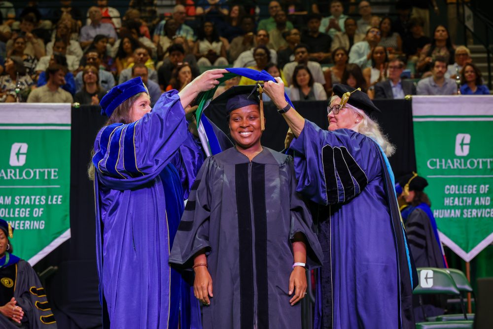 A doctoral candiadte is hooded.