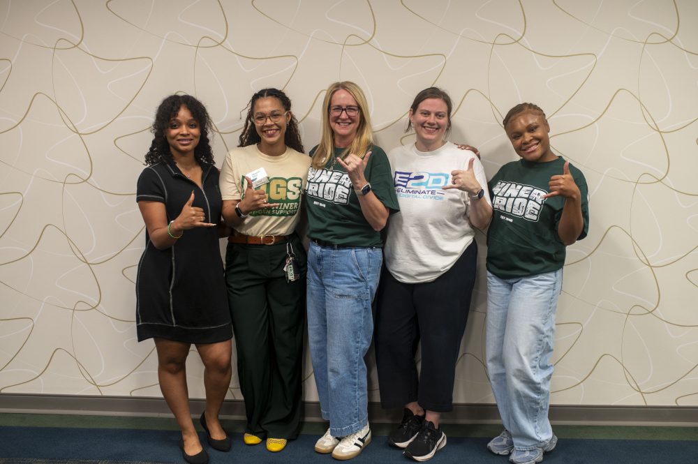 UNC Charlotte and E2D volunteers throw picks up