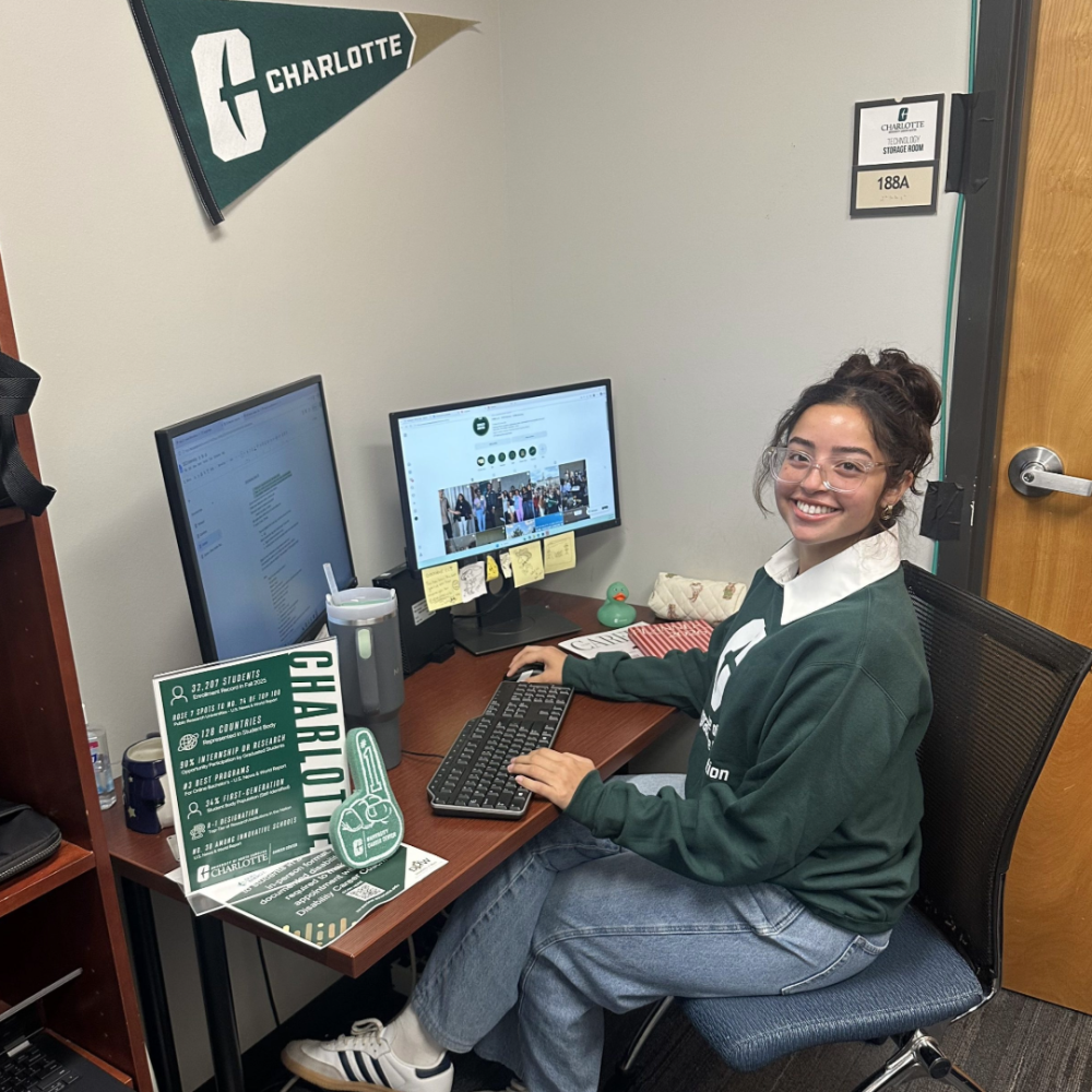 Gabby Rivera sits a her desk inside the UNC Charlotte Career Center