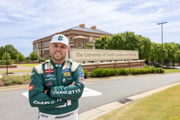 Layne Riggs '24 at front gate on UNC Charlotte