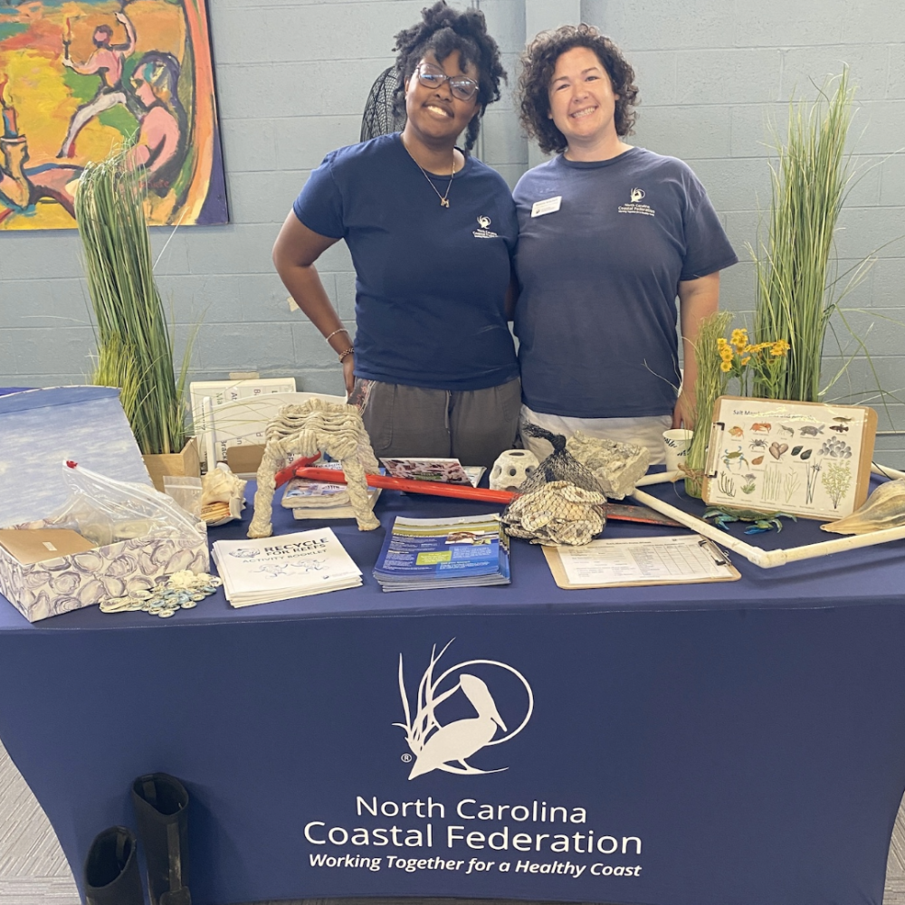 Meaira Alston stands at North Carolina Costal Federation tabling