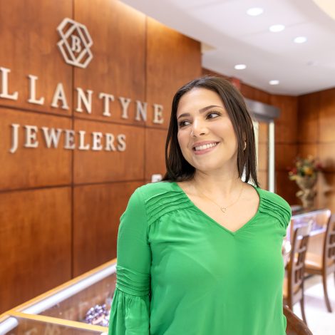 Woman smiling inside a jewelry store with 